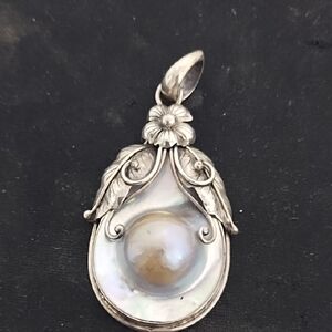 Elegant Silver Floral Pendant